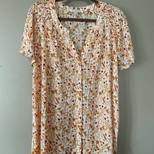 Rose & Olive orange flowered, flouncy shirt.